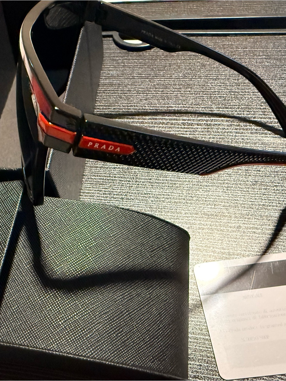 Sleek and Sporty Black Sunglasses with Red Trim
